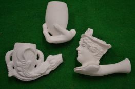 A collection of clay pipe bowls.