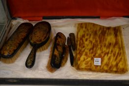Tortoiseshell dressing table items.