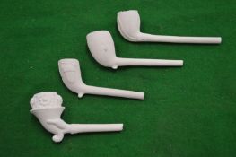 A collection of clay pipe bowls.