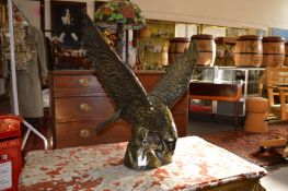A large cast brass model of a eagle.