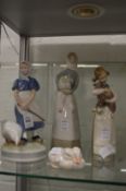 Royal Copenhagen figure of a girl and a goose, another of two ducks together with two Lladro