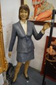 An unusual life size papier mache model of a standing woman.