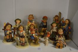 A collection of Goebel and Hummel figures.