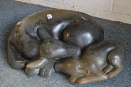 Ronnie Dongo, a carved stone sculpture of a deer and fawn asleep.