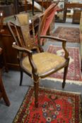 A late Victorian inlaid mahogany armchair.