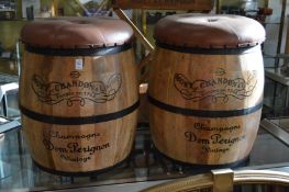 A pair of novelty barrel shaped bar stools with removable button upholstered tops.