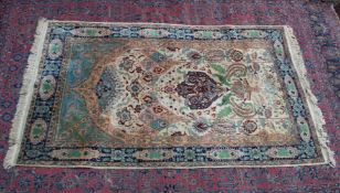 A Persian carpet, cream ground with stylised decoration depicting birds and an archway 7'9