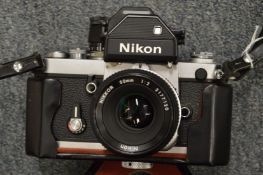 A Nikon F2 camera with 50mm lens and case.
