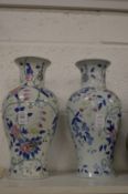 A pair of Chinese style baluster shaped vases.