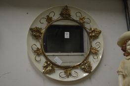 A decorative circular mirror.
