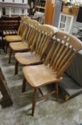 A set of four beech and elm kitchen chairs.