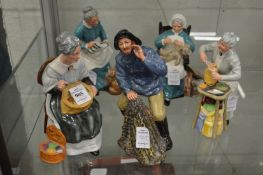 A group of five Royal Doulton figures.