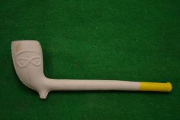A decorative clay pipe.