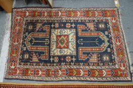 A small Persian rug, blue ground with geometric decoration 4' x 2'8