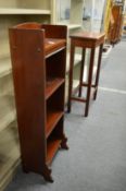 A small bookcase and a table.