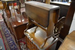 A pair of mahogany drop flap occasional tables.