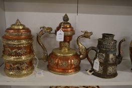 A Chinese copper and white metal decorative jar and cover with similar ewer and another ewer.