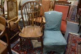 A wheel back armchair and a bedroom chair.