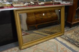 A gilt framed rectangular mirror.
