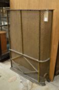 Steel and brass part radiator cover.