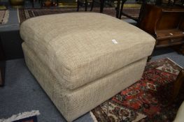 A modern upholstered foot stool.