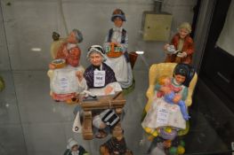 A group of five Royal Doulton figures.