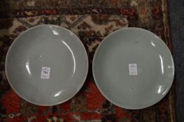 A pair of celadon dishes.