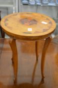 An inlaid circular occasional table.