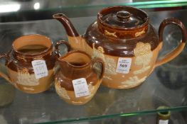 A Doulton salt glazed three piece tea service.
