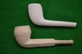 Two small clay pipes.
