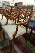 A pair of Edwardian inlaid mahogany open armchairs.