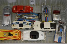 various Porsche and other die cast model cars.
