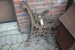 A pair of cast iron bench ends.
