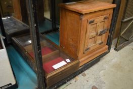 A small display cabinet and a table top cabinet.