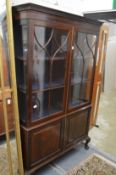 A mahogany cupboard bookcase.