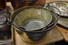 Three brass preserve pans.