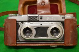 An Edixa stereo camera with leather case.