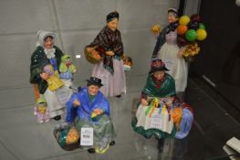 A group of five Royal Doulton figures.