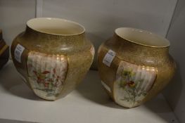 A pair of Doulton jardinieres.