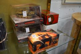 Two model tanks in original packaging, a Matchbox armoured car, boxed and a Matchbox fire engine.
