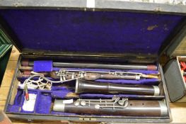 A cased bassoon stamped Riviere and Hawkes 28 Leicester Square London.