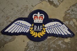 A novelty cast iron sign.