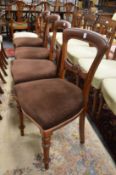 A set of four Victorian mahogany dining chairs and a similar chair.