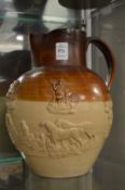 A large salt glazed hunting jug.