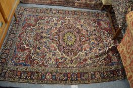 A Persian carpet with stylised floral decoration 6'8