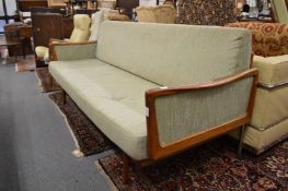 A Scandinavian teak framed settee with canework back panels (faults).