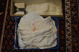 Christening gowns and other textiles together with a feather fan with original box.