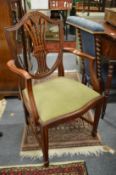A set of eight hepplewhite style mahogany dining chairs, two with arms.