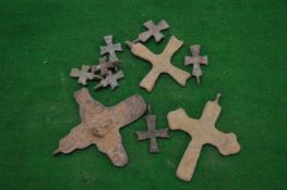 Small bronze crosses.