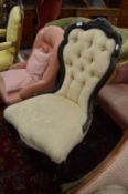A Victorian button upholstered nursing chair.